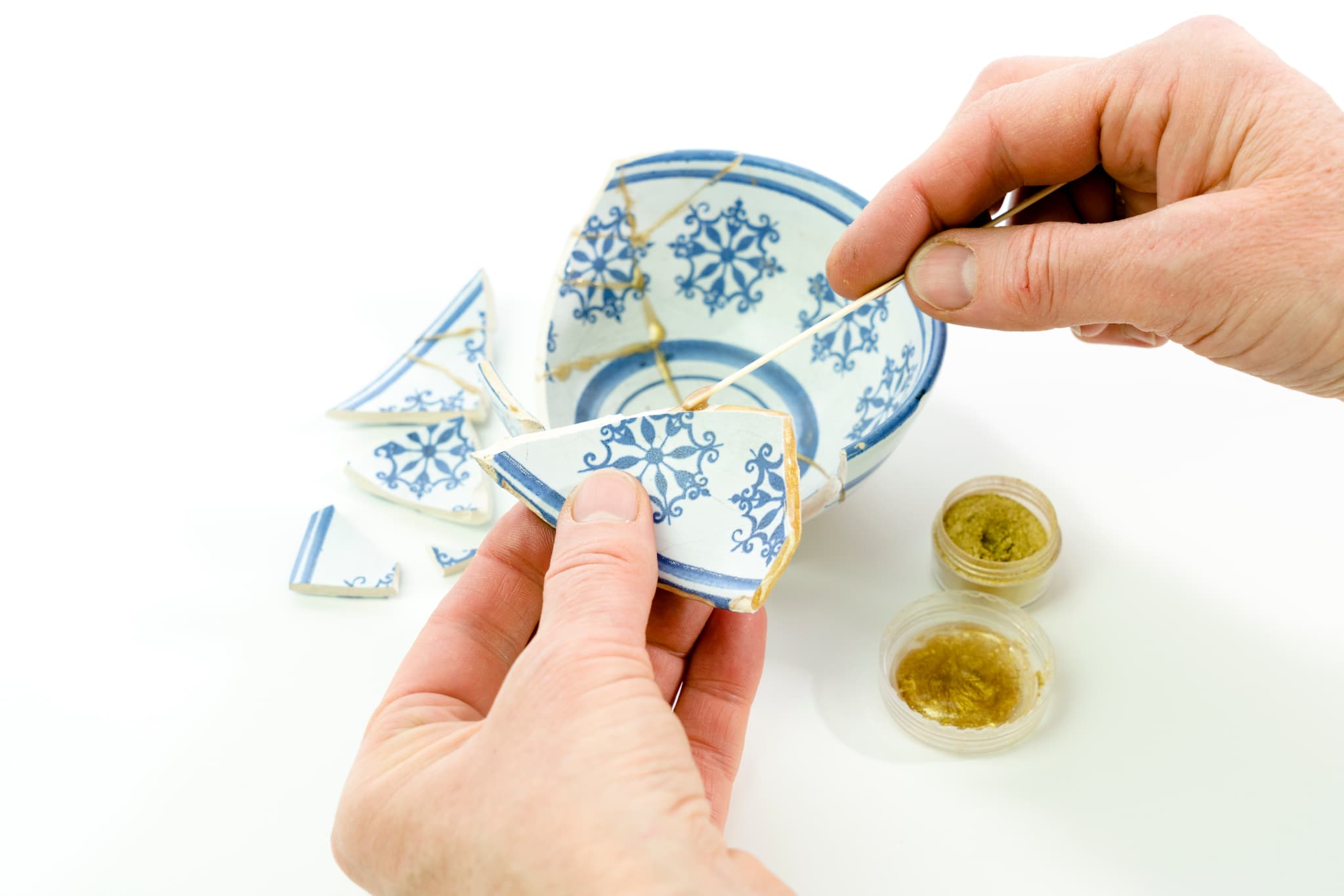 What is japanese art of repairing with gold called?